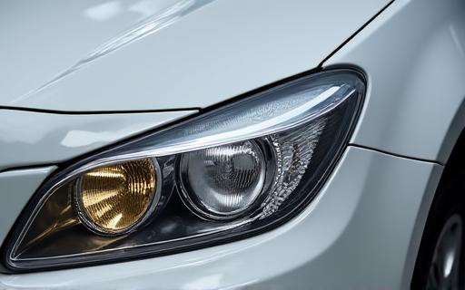 A split image showing a cloudy vs a clear headlight.